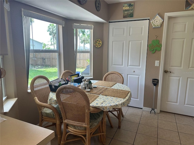 4027 Allure Ln, North Port, FL 34287 - dining area featuring light tile patterned flooring and baseboards