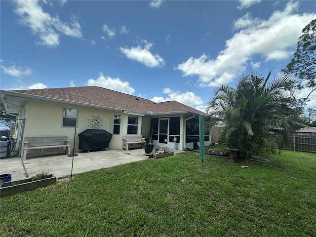 4027 Allure Ln, North Port, FL 34287 - rear view of house with a sunroom, a patio area, stucco siding, and roof with shingles