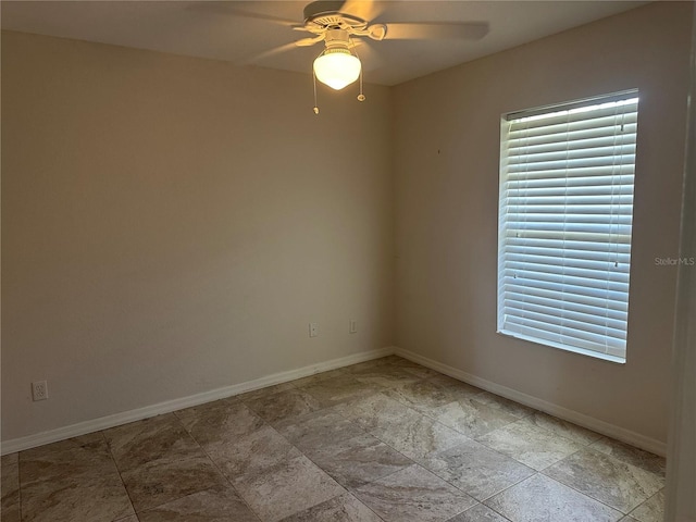 4027 Allure Ln, North Port, FL 34287 - unfurnished room with a ceiling fan and light stone finish floors