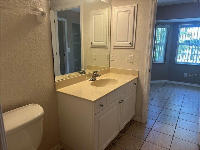 4027 Allure Ln, North Port, FL 34287 - bathroom with vanity, tile patterned flooring, and a textured wall
