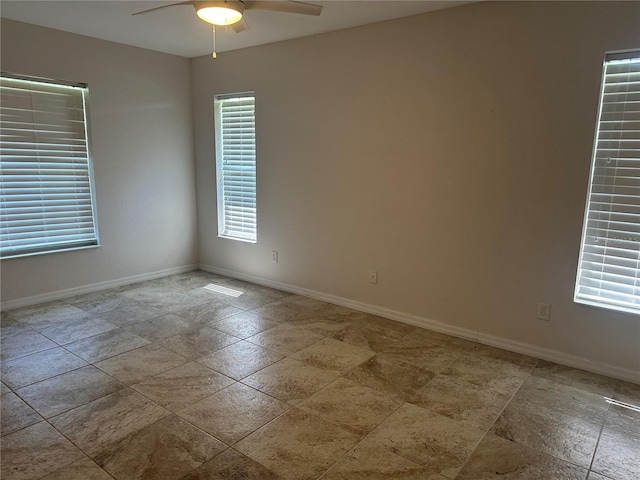 4027 Allure Ln, North Port, FL 34287 - empty room featuring a ceiling fan and baseboards