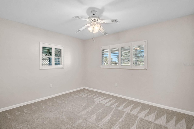 149 Small St SE, Port Charlotte, FL 33952 - carpeted empty room featuring baseboards and ceiling fan