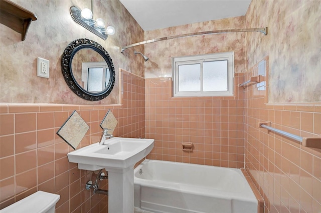 149 Small St SE, Port Charlotte, FL 33952 - bathroom featuring tile walls, shower / tub combination, and toilet