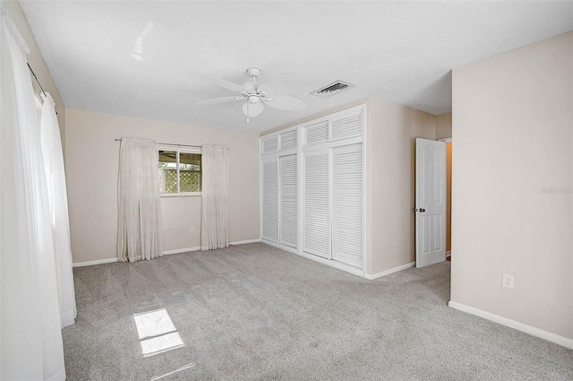 149 Small St SE, Port Charlotte, FL 33952 - unfurnished bedroom featuring carpet flooring, a closet, baseboards, and ceiling fan
