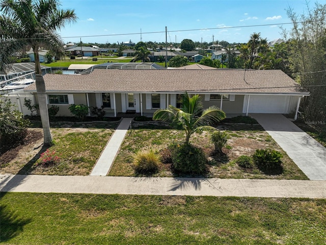 149 Small St SE, Port Charlotte, FL 33952 - ranch-style home featuring a garage, driveway, and a front yard