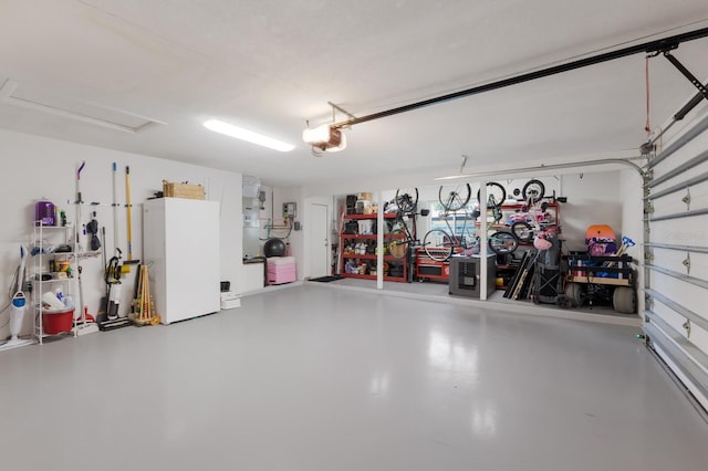 5581 Shadow Lawn Dr, Sarasota, FL 34242 - garage with freestanding refrigerator and a garage door opener