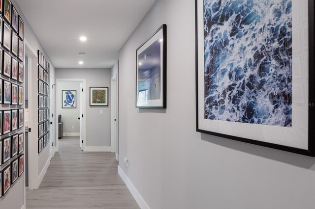 5581 Shadow Lawn Dr, Sarasota, FL 34242 - hall with baseboards, light wood-style flooring, and recessed lighting