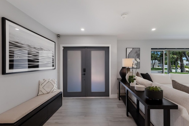 5581 Shadow Lawn Dr, Sarasota, FL 34242 - entrance foyer featuring french doors, recessed lighting, and light wood-style flooring