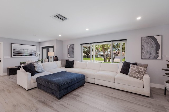 5581 Shadow Lawn Dr, Sarasota, FL 34242 - living area featuring recessed lighting, baseboards, and light wood-type flooring