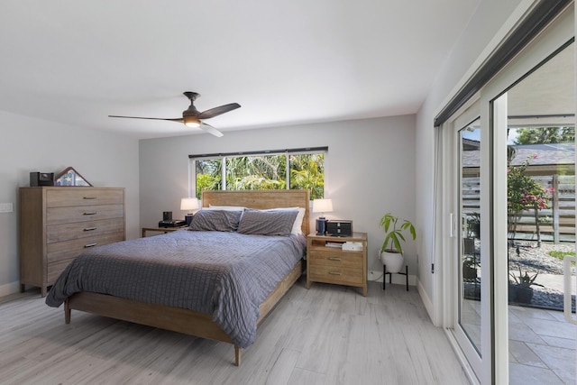 5581 Shadow Lawn Dr, Sarasota, FL 34242 - bedroom with access to outside, baseboards, a ceiling fan, and light wood finished floors