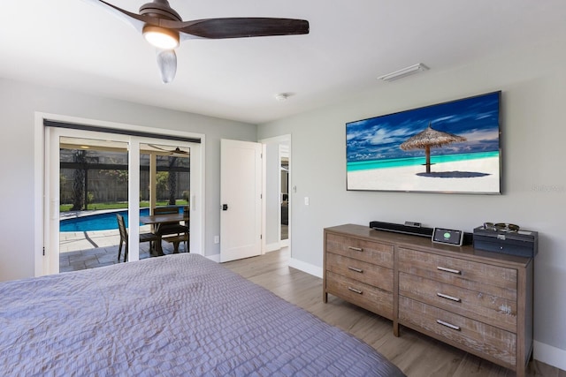 5581 Shadow Lawn Dr, Sarasota, FL 34242 - bedroom featuring access to outside, wood finished floors, baseboards, and a ceiling fan