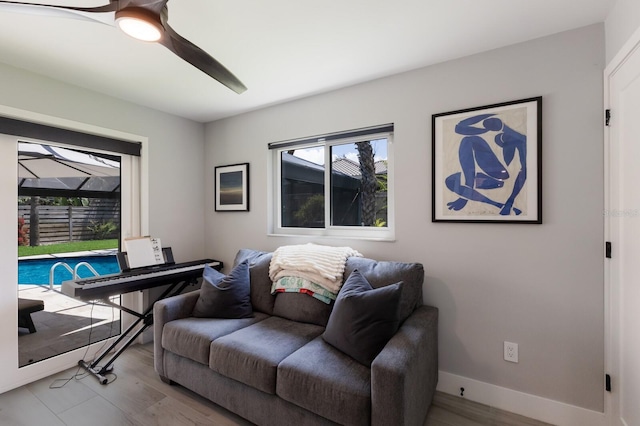 5581 Shadow Lawn Dr, Sarasota, FL 34242 - living room featuring wood finished floors, ceiling fan, and baseboards