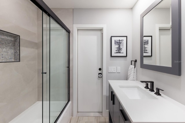 5581 Shadow Lawn Dr, Sarasota, FL 34242 - bathroom featuring vanity and shower / bath combination with glass door