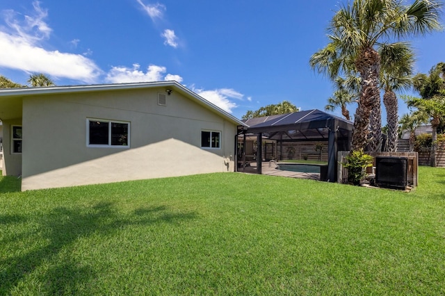 5581 Shadow Lawn Dr, Sarasota, FL 34242 - back of property featuring stucco siding and a lanai