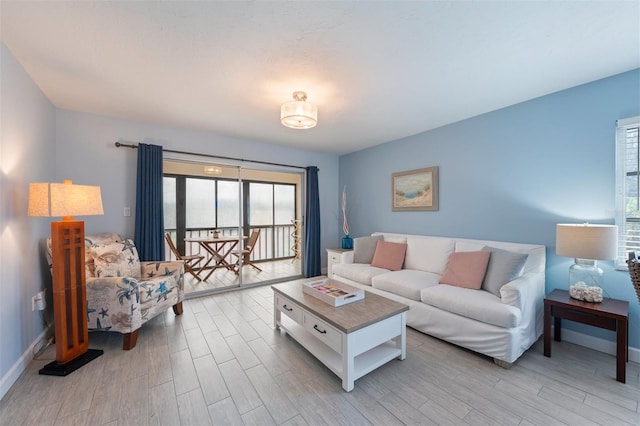 110 Vista Hermosa Cir Unit 302B, Sarasota, FL 34242 - living area with light wood-style floors and baseboards