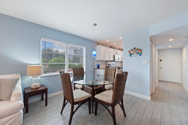 110 Vista Hermosa Cir Unit 302B, Sarasota, FL 34242 - dining space with light wood finished floors, baseboards, and recessed lighting