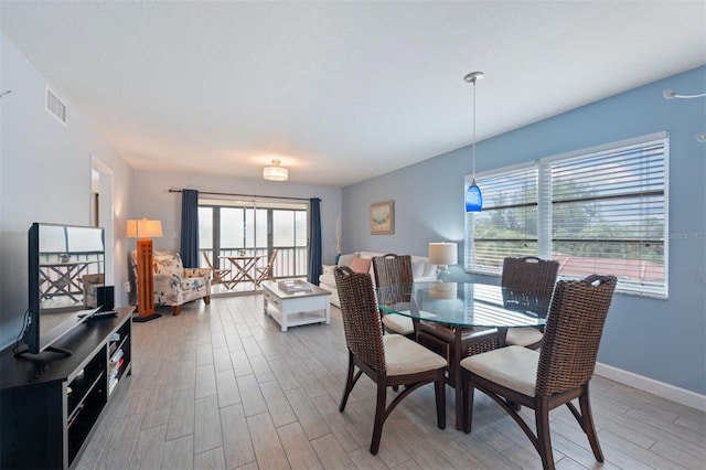 110 Vista Hermosa Cir Unit 302B, Sarasota, FL 34242 - dining area with wood finished floors and baseboards