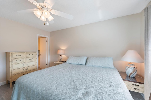 110 Vista Hermosa Cir Unit 302B, Sarasota, FL 34242 - bedroom featuring wood finished floors, ceiling fan, and baseboards