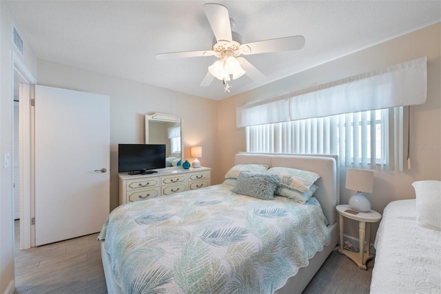110 Vista Hermosa Cir Unit 302B, Sarasota, FL 34242 - bedroom featuring wood finished floors and a ceiling fan