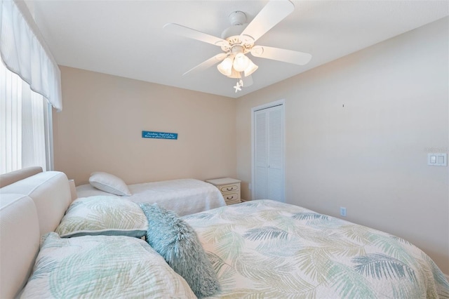 110 Vista Hermosa Cir Unit 302B, Sarasota, FL 34242 - bedroom with a closet and a ceiling fan