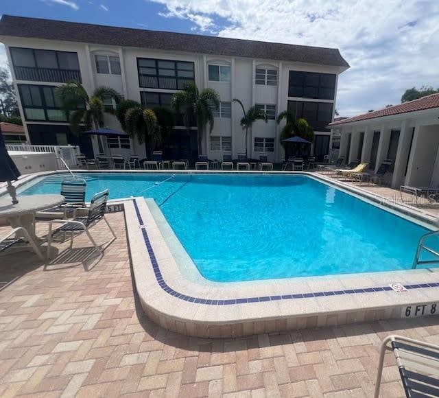 110 Vista Hermosa Cir Unit 302B, Sarasota, FL 34242 - community pool featuring a patio