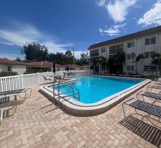 110 Vista Hermosa Cir Unit 302B, Sarasota, FL 34242 - community pool with a patio area