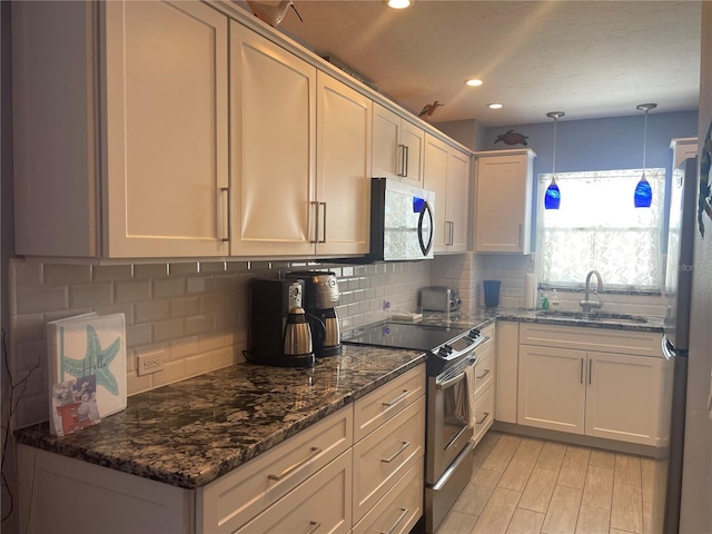 110 Vista Hermosa Cir Unit 302B, Sarasota, FL 34242 - kitchen with a sink, appliances with stainless steel finishes, healthy amount of natural light, backsplash, and recessed lighting