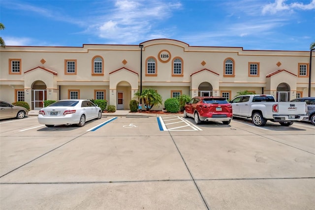 1216 Rio De Janeiro Ave Unit 306, Punta Gorda, FL 33983 - view of front of house with uncovered parking and stucco siding