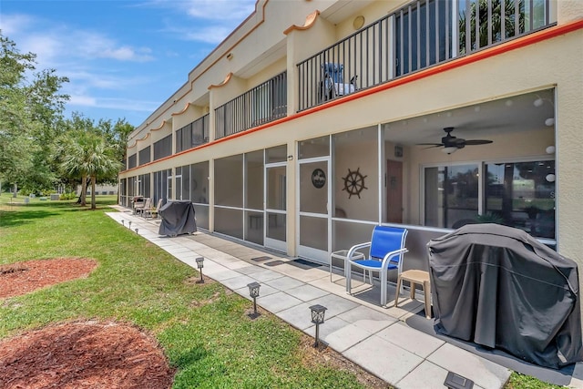 1216 Rio De Janeiro Ave Unit 306, Punta Gorda, FL 33983 - back of property with a patio, a balcony, a yard, and ceiling fan