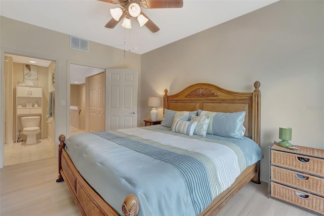 1216 Rio De Janeiro Ave Unit 306, Punta Gorda, FL 33983 - bedroom with ensuite bathroom, a ceiling fan, and light wood-type flooring