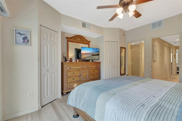 1216 Rio De Janeiro Ave Unit 306, Punta Gorda, FL 33983 - bedroom featuring two closets, baseboards, and ceiling fan