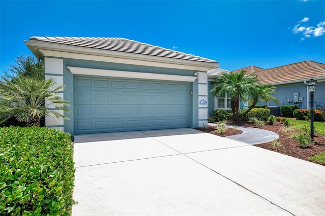 12229 Stuart Dr, Venice, FL 34293 - ranch-style house with driveway, a garage, stucco siding, and a tiled roof