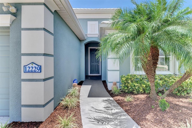 12229 Stuart Dr, Venice, FL 34293 - entrance to property featuring stucco siding