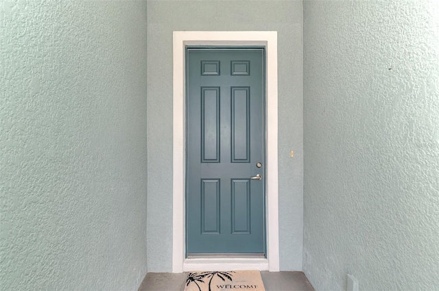 12229 Stuart Dr, Venice, FL 34293 - property entrance with stucco siding