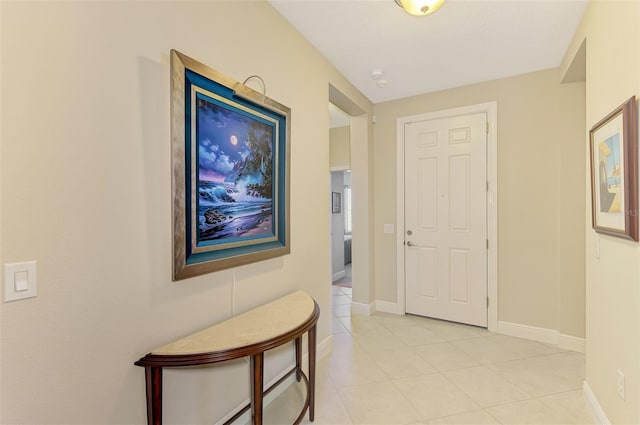 12229 Stuart Dr, Venice, FL 34293 - hall featuring light tile patterned floors and baseboards