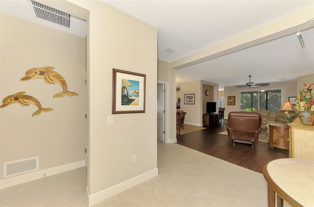 12229 Stuart Dr, Venice, FL 34293 - corridor featuring tile patterned floors and baseboards