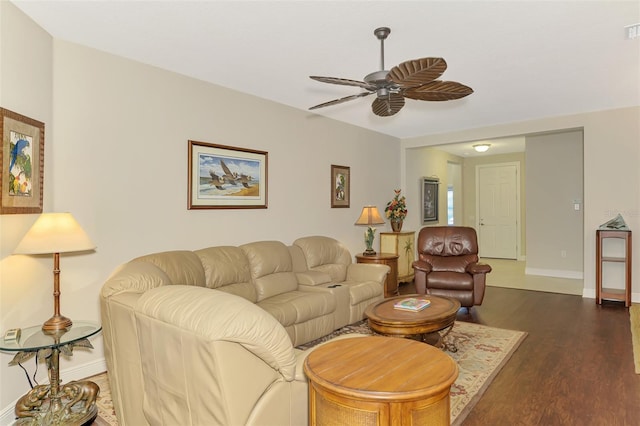12229 Stuart Dr, Venice, FL 34293 - living area featuring a ceiling fan, dark wood-style floors, and baseboards