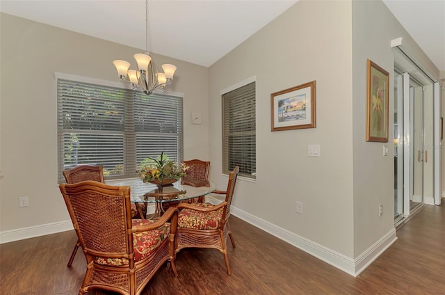 12229 Stuart Dr, Venice, FL 34293 - dining space with wood finished floors, a chandelier, baseboards, and lofted ceiling