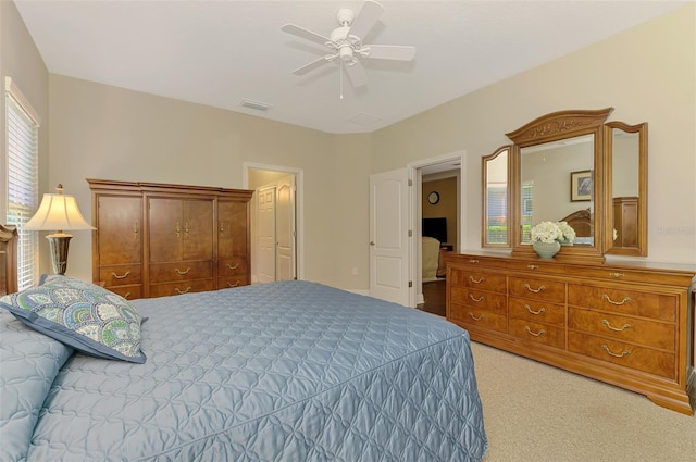12229 Stuart Dr, Venice, FL 34293 - bedroom with light colored carpet and a ceiling fan