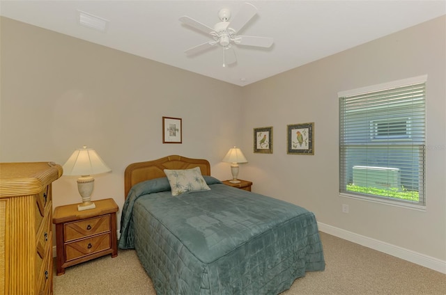 12229 Stuart Dr, Venice, FL 34293 - bedroom featuring light colored carpet, baseboards, and ceiling fan