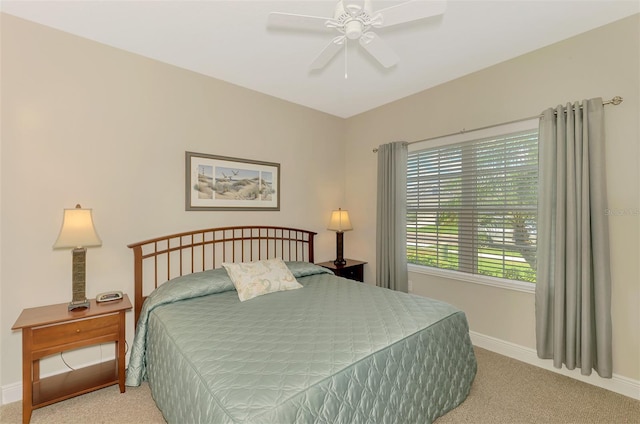 12229 Stuart Dr, Venice, FL 34293 - carpeted bedroom featuring baseboards and a ceiling fan