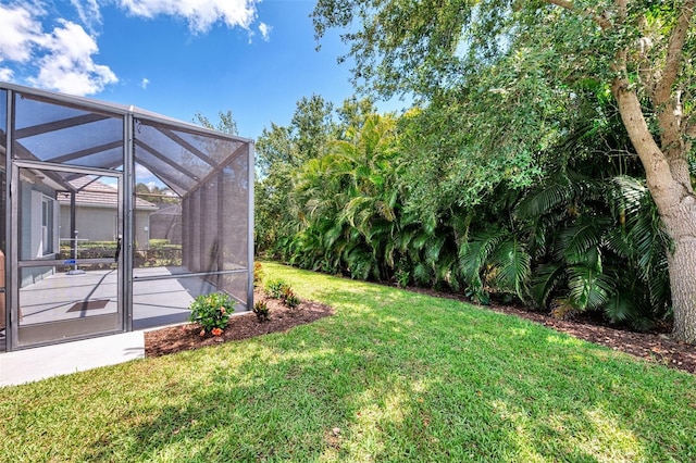 12229 Stuart Dr, Venice, FL 34293 - view of grassy yard with a lanai and a patio area