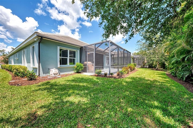 12229 Stuart Dr, Venice, FL 34293 - back of property with stucco siding, a yard, and a lanai