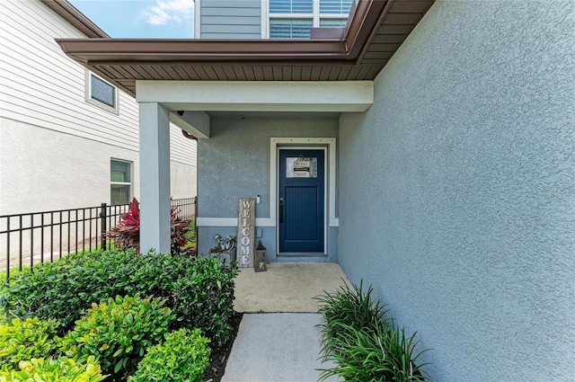 8940 Royal River Cir, Parrish, FL 34219 - view of exterior entry featuring stucco siding