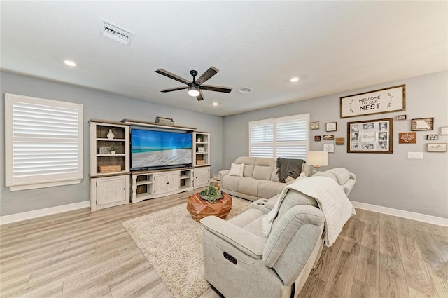 8940 Royal River Cir, Parrish, FL 34219 - living area featuring a ceiling fan, baseboards, light wood-style floors, and recessed lighting