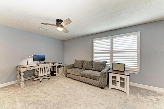 8940 Royal River Cir, Parrish, FL 34219 - home office featuring ceiling fan, carpet flooring, baseboards, and a textured ceiling