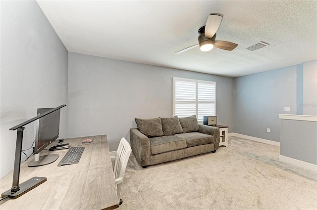 8940 Royal River Cir, Parrish, FL 34219 - carpeted home office featuring ceiling fan, a textured ceiling, and baseboards