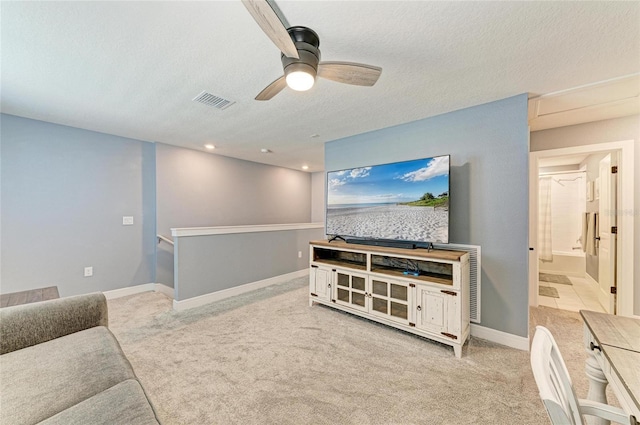 8940 Royal River Cir, Parrish, FL 34219 - carpeted living room with a textured ceiling, a ceiling fan, baseboards, and recessed lighting