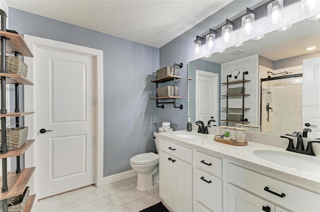 8940 Royal River Cir, Parrish, FL 34219 - bathroom featuring a shower stall, double vanity, toilet, tile patterned flooring, and a textured ceiling