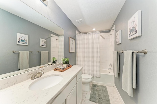 8940 Royal River Cir, Parrish, FL 34219 - full bathroom with toilet, vanity, shower / tub combo with curtain, tile patterned floors, and a textured ceiling